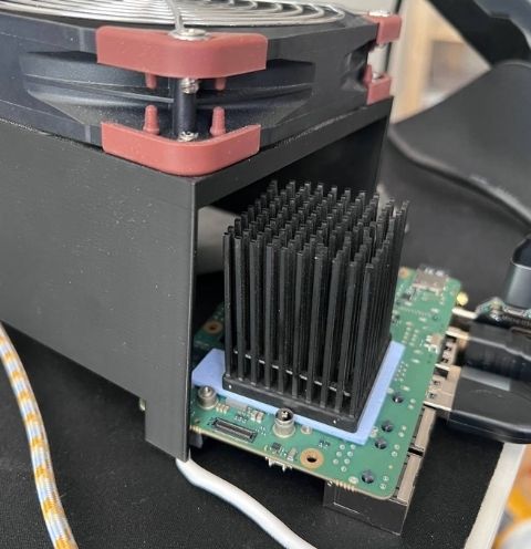 Radxa Dragon Q8B with Noctua fan and large heatsink attempting to cool the PMICs
